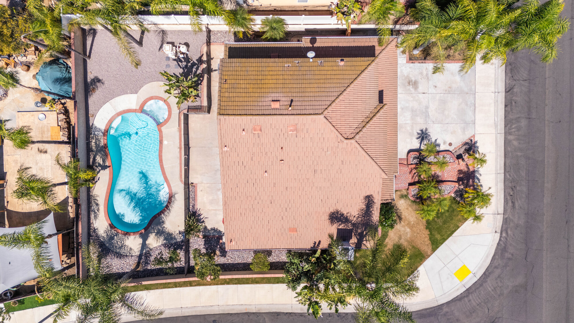 Top-down aerial photograph of a home with a backyard pool