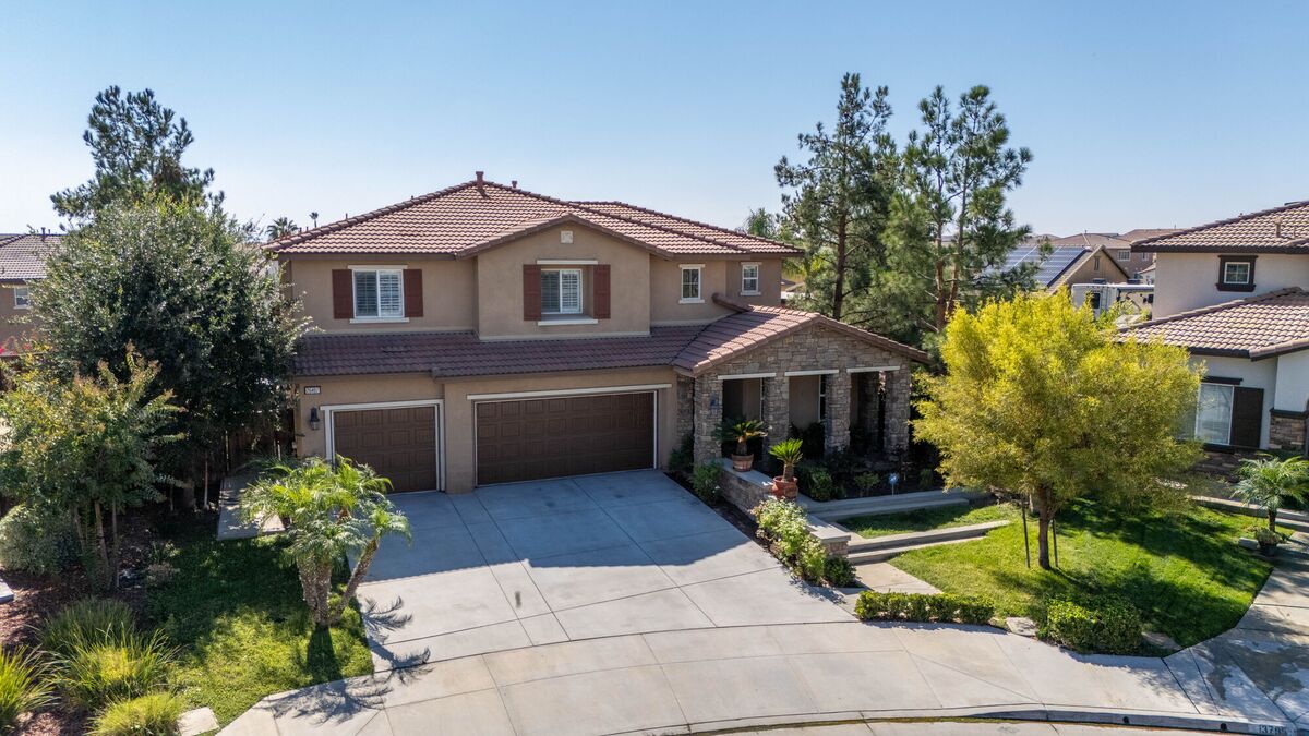 Elevated exterior view of a two-story home and its landscaping