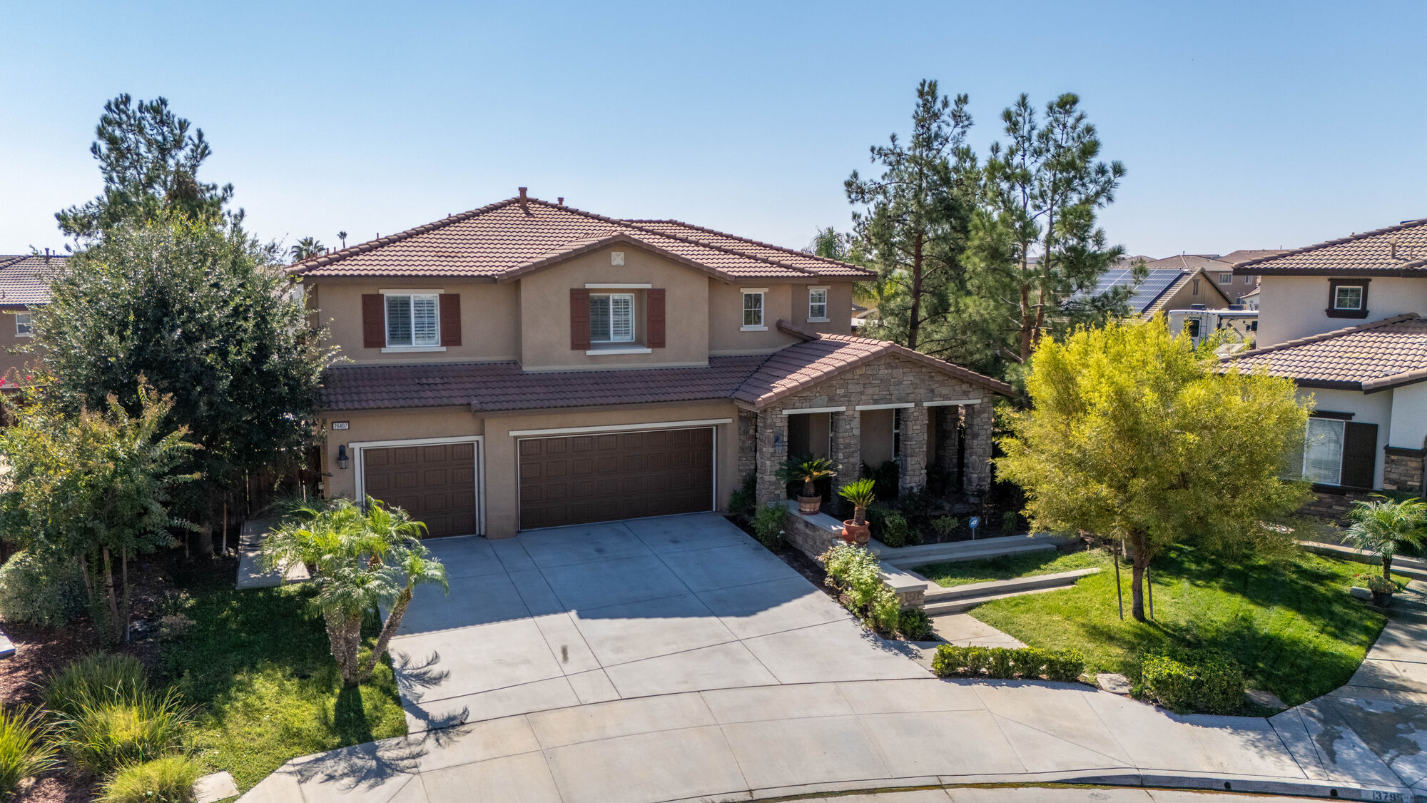 Elevated exterior view of a two-story home and its landscaping