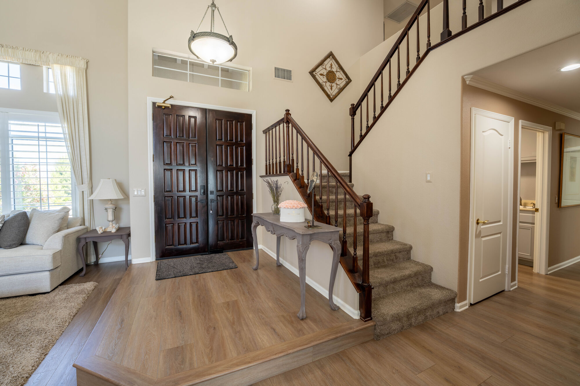 Staged entry and staircase prepared for real estate photography