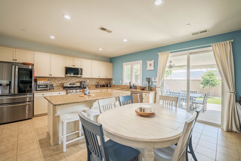 White kitchen with island seating
