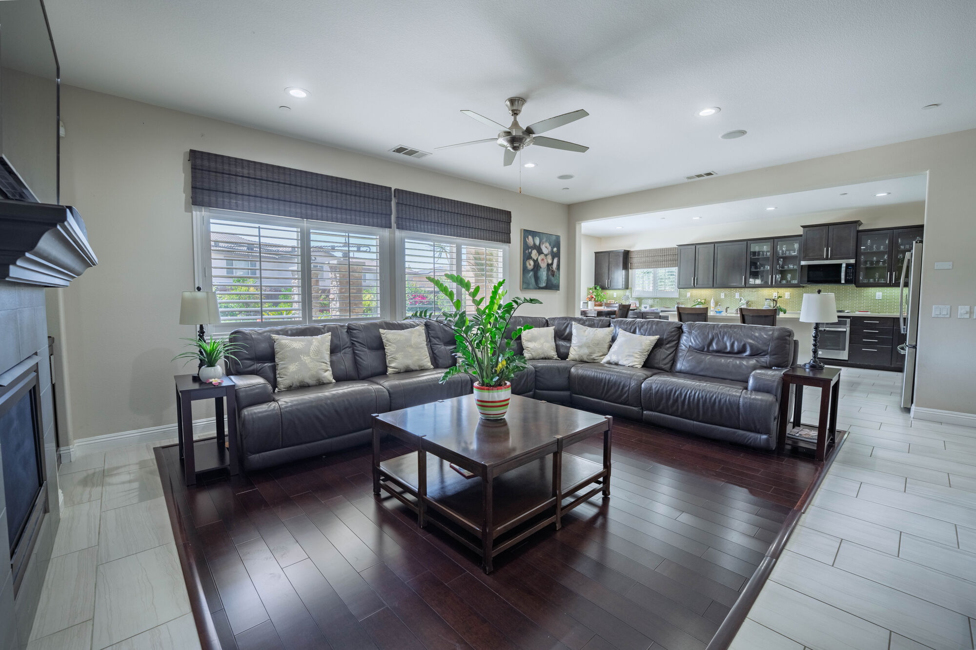 Staged living room with natural light and dark wood floors