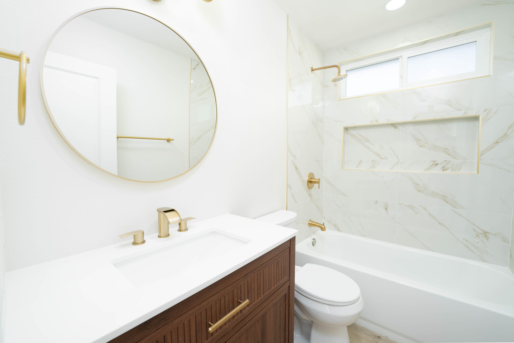 Updated bathroom photographed with bright, even lighting