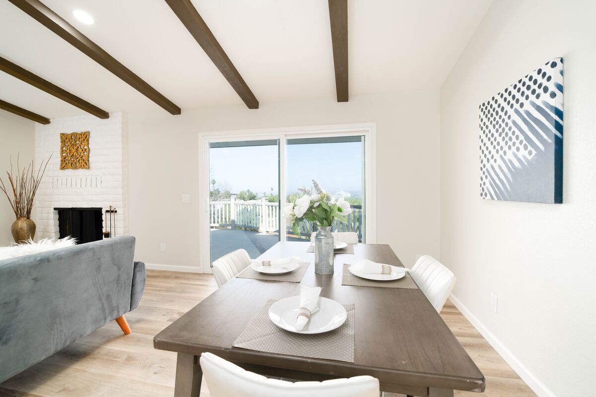 Bright dining area with ceiling beams prepared for a professional real estate photo shoot